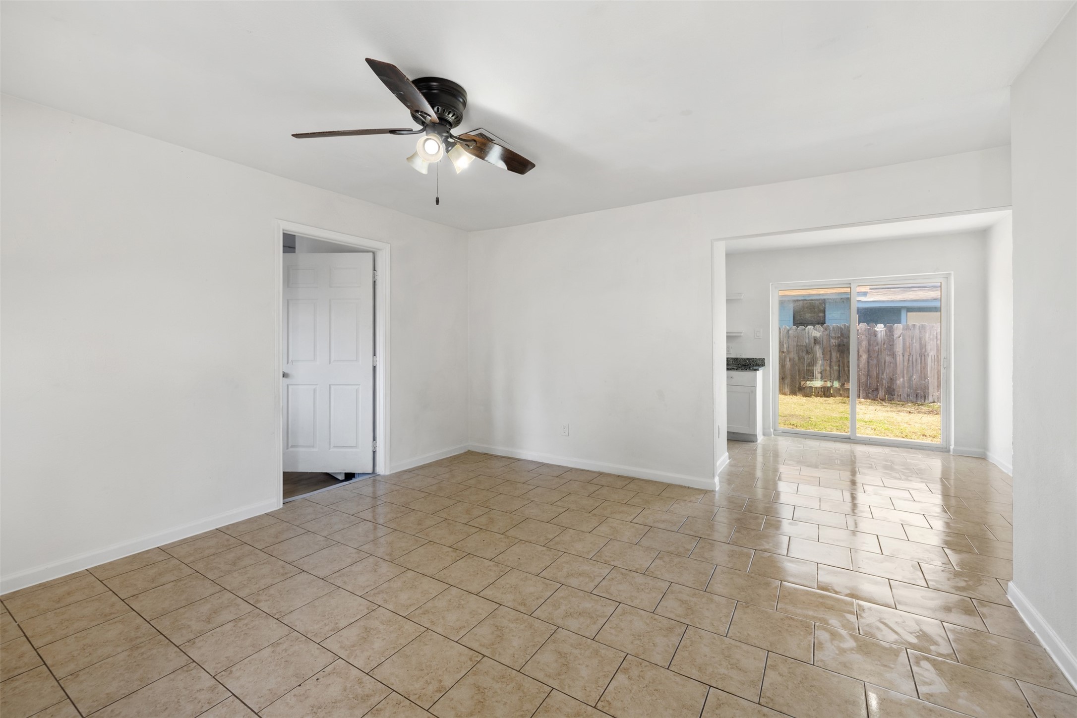 9802 Lum Lane Houston, TX 77078 - Photo 4 of 45 Upon entry, the living room in main home greets you facing slide door ahead, and 4th bedroom to your left