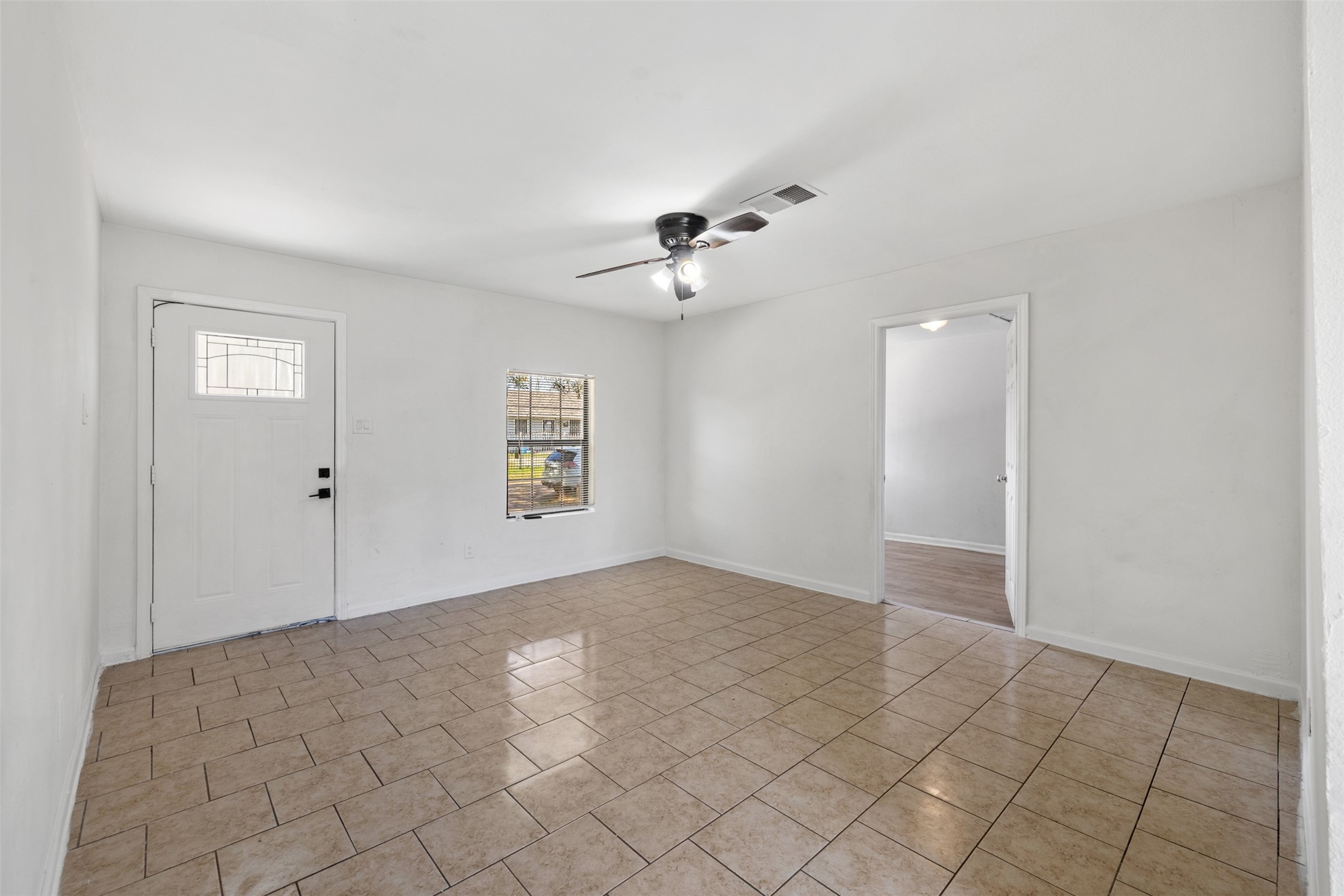 9802 Lum Lane Houston, TX 77078 - Photo 6 of 45 Living room view facing the entry door. No carpet all around!