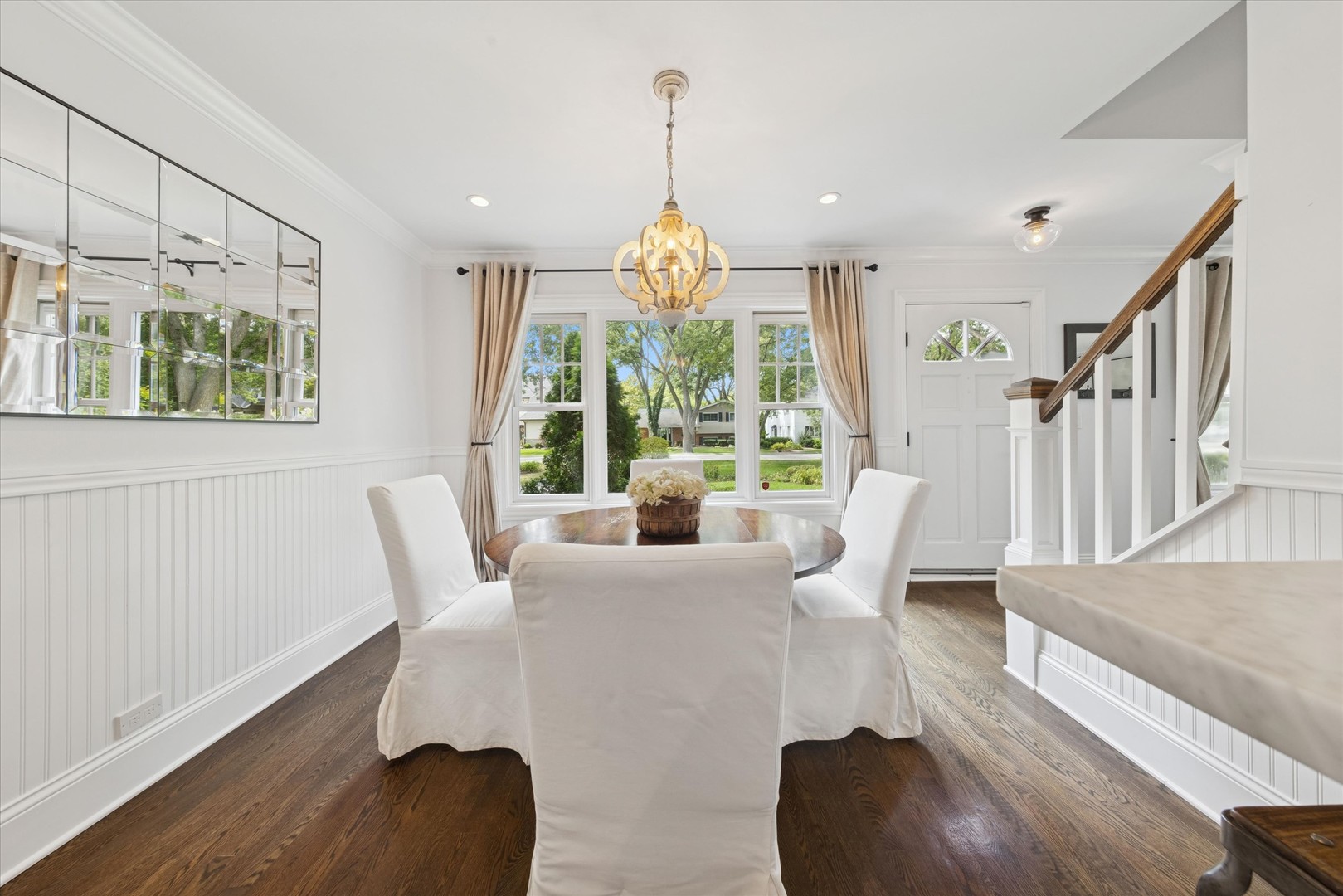 561 North County Line Road Hinsdale, IL 60521 - Photo 4 of 30 a dining room with furniture a chandelier and wooden floor
