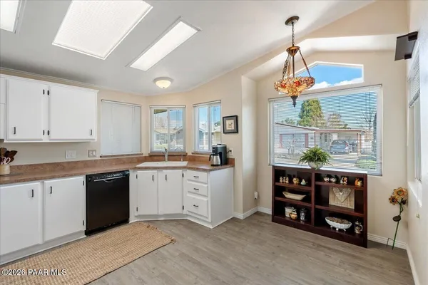 a open kitchen with stainless steel appliances granite countertop a stove and cabinets