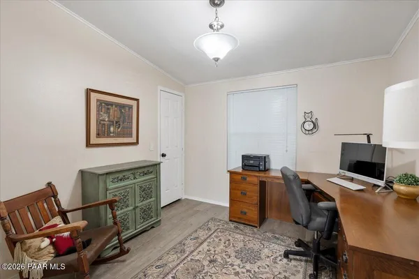 a workspace with furniture and wooden floor