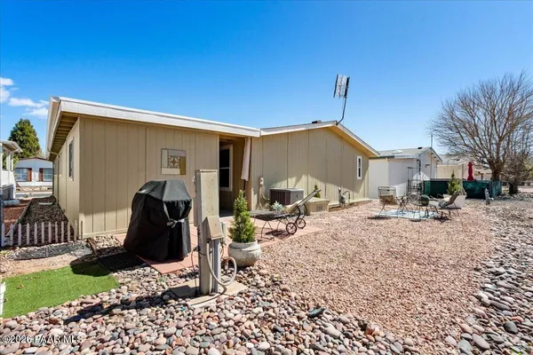 a view of a backyard with a patio
