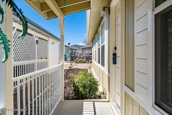 a view of balcony and wooden floor