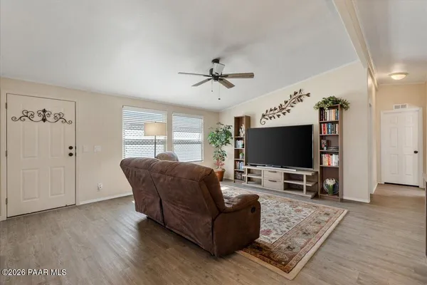 a living room with furniture and a flat screen tv