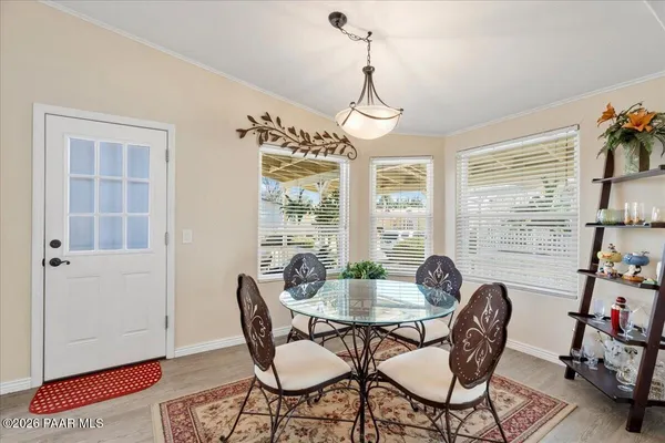 a view of a dining room with furniture window and outside view