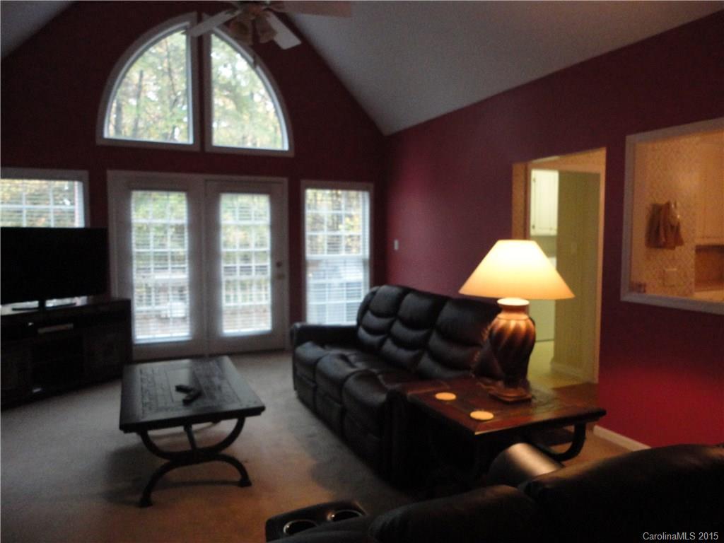 2675 Island View Road, Unit 1 Fort Mill, SC 29708 - Photo 17 of 24 a living room with furniture and a floor to ceiling window