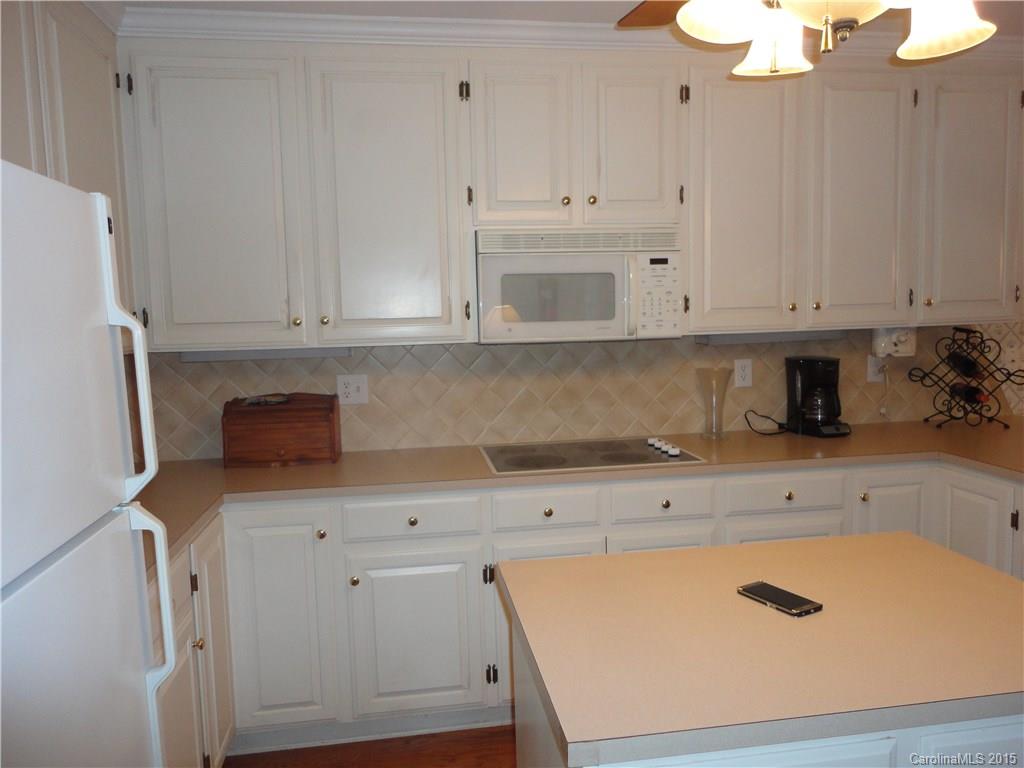 2675 Island View Road, Unit 1 Fort Mill, SC 29708 - Photo 22 of 24 a kitchen with stainless steel appliances white cabinets and a sink