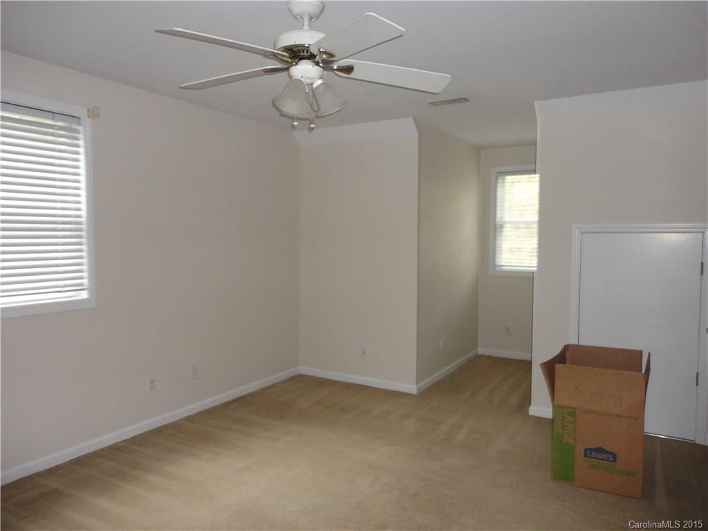 2675 Island View Road, Unit 1 Fort Mill, SC 29708 - Photo 8 of 24 an empty room with windows and fan