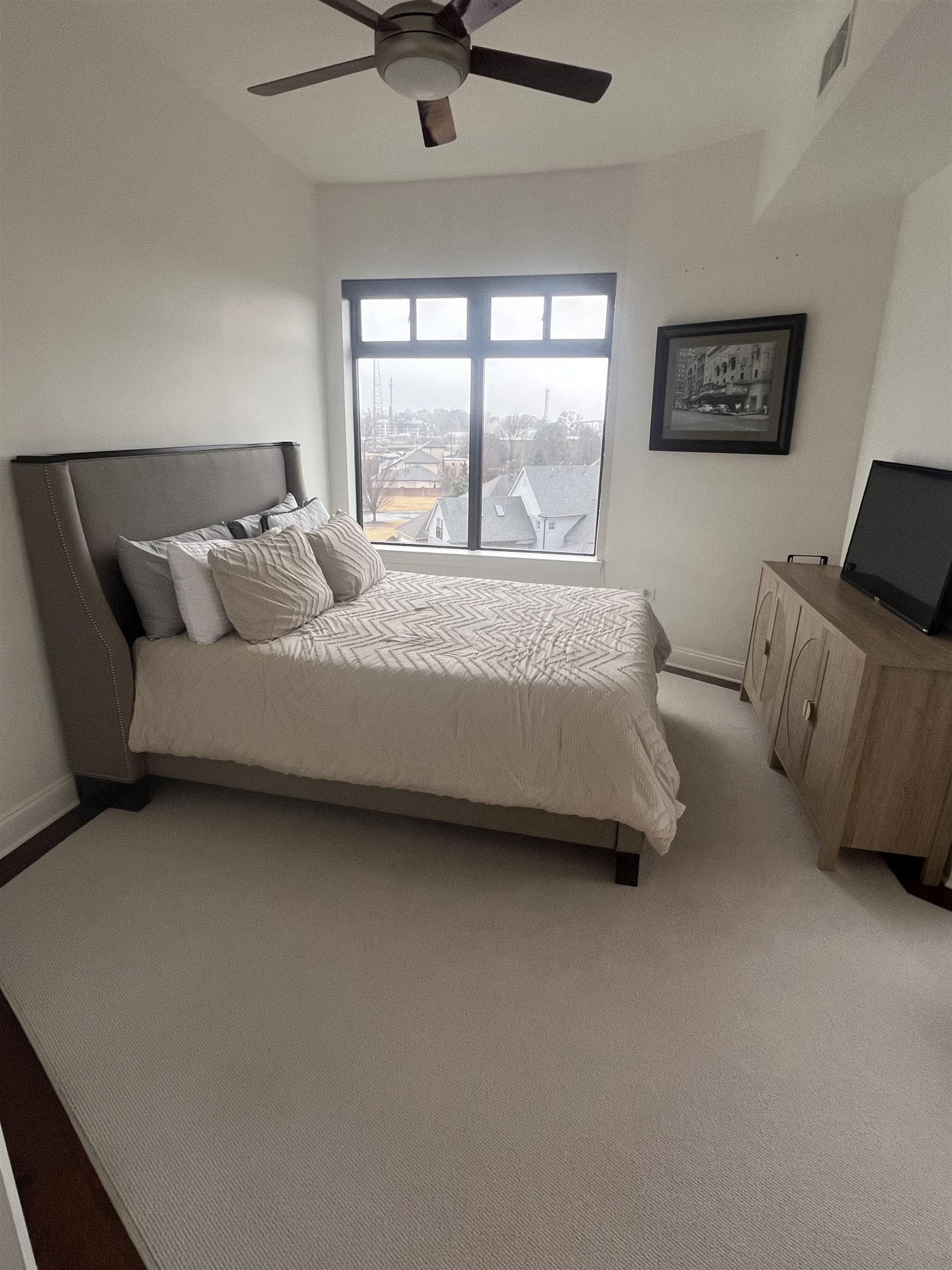 717 Riverside Drive, Unit 505 Memphis, TN 38103 - Photo 14 of 24 a bedroom with a bed and window