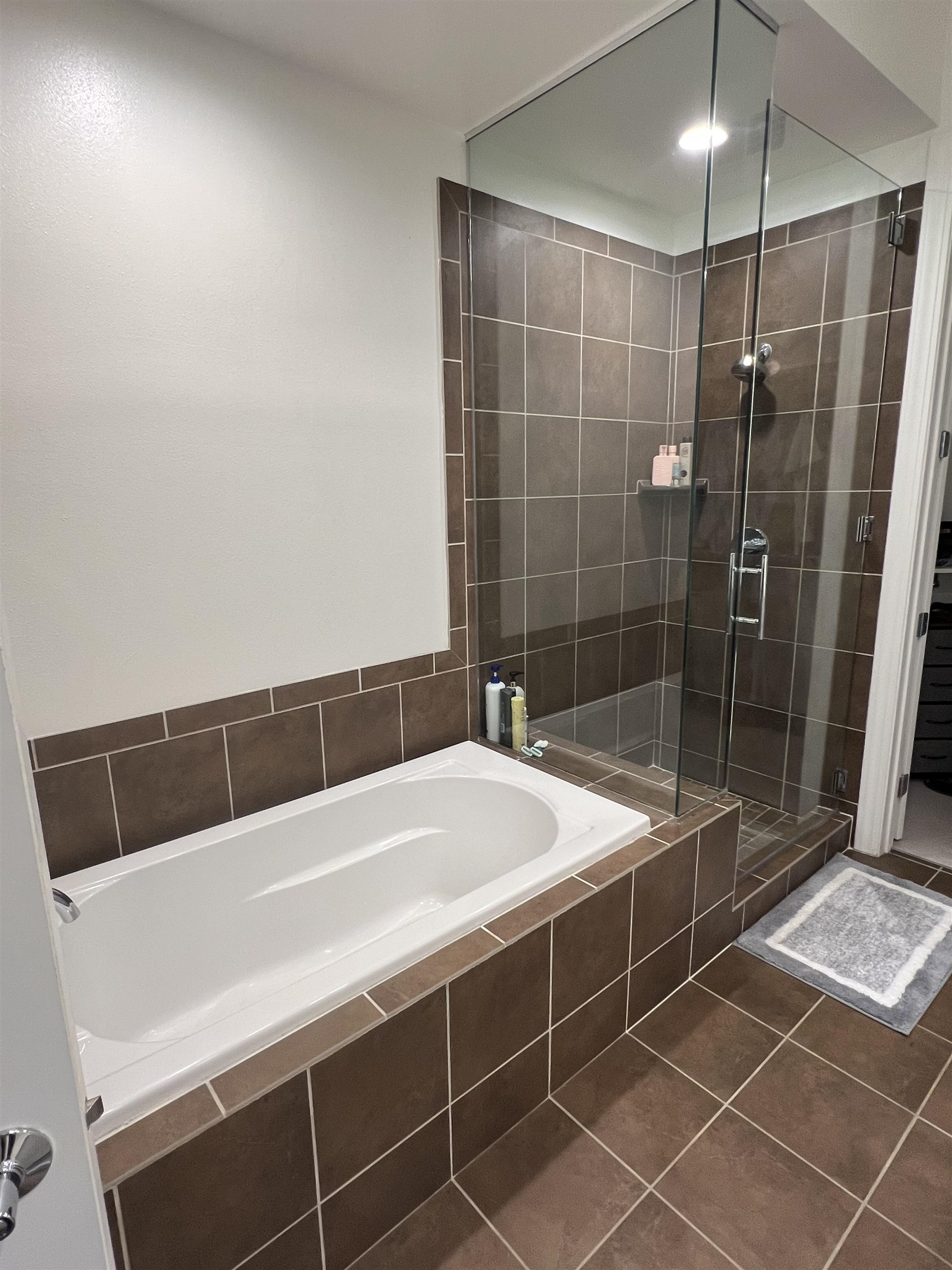 717 Riverside Drive, Unit 505 Memphis, TN 38103 - Photo 17 of 24 Bathroom with plus walk in shower and tile patterned floors