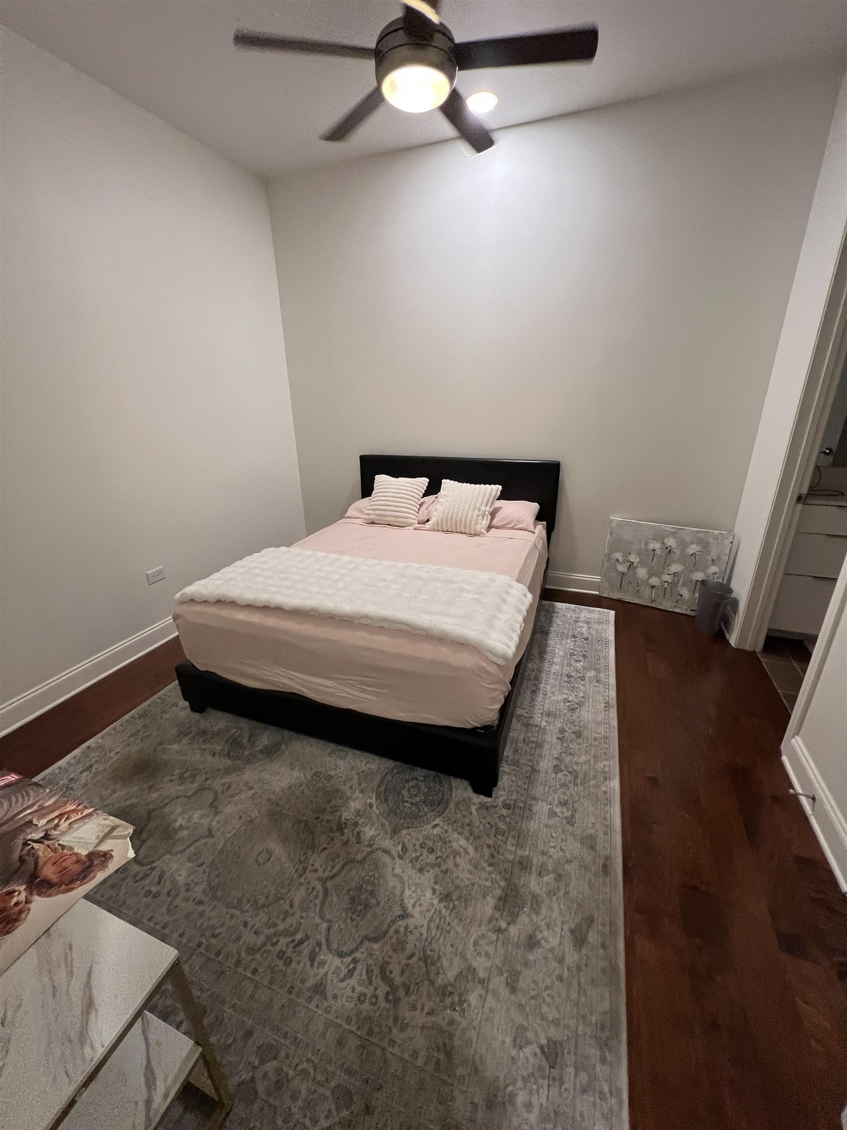 717 Riverside Drive, Unit 505 Memphis, TN 38103 - Photo 18 of 24 a bedroom with a bed and wooden floor