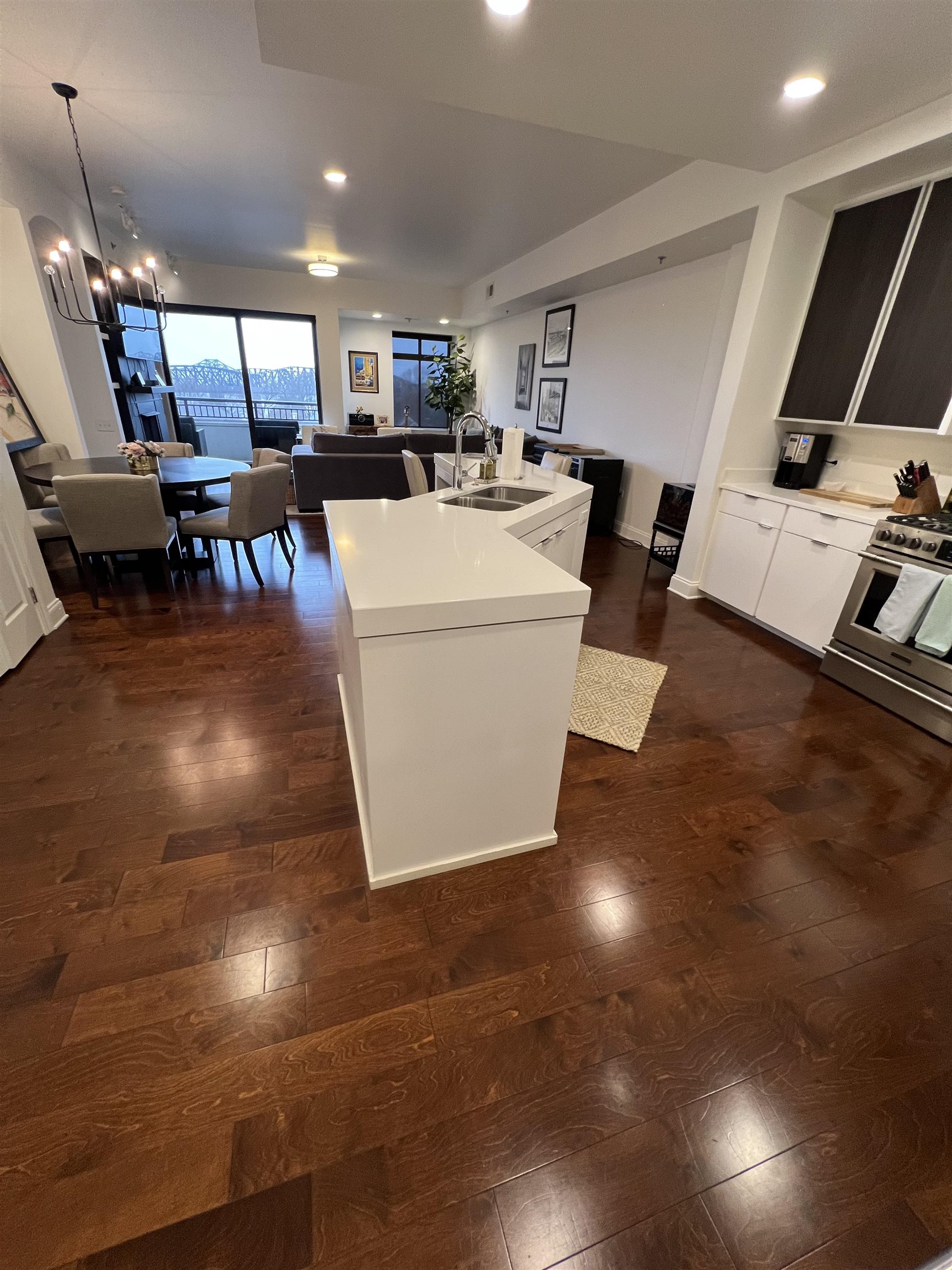 717 Riverside Drive, Unit 505 Memphis, TN 38103 - Photo 8 of 24 a living room with lots of furniture and kitchen view