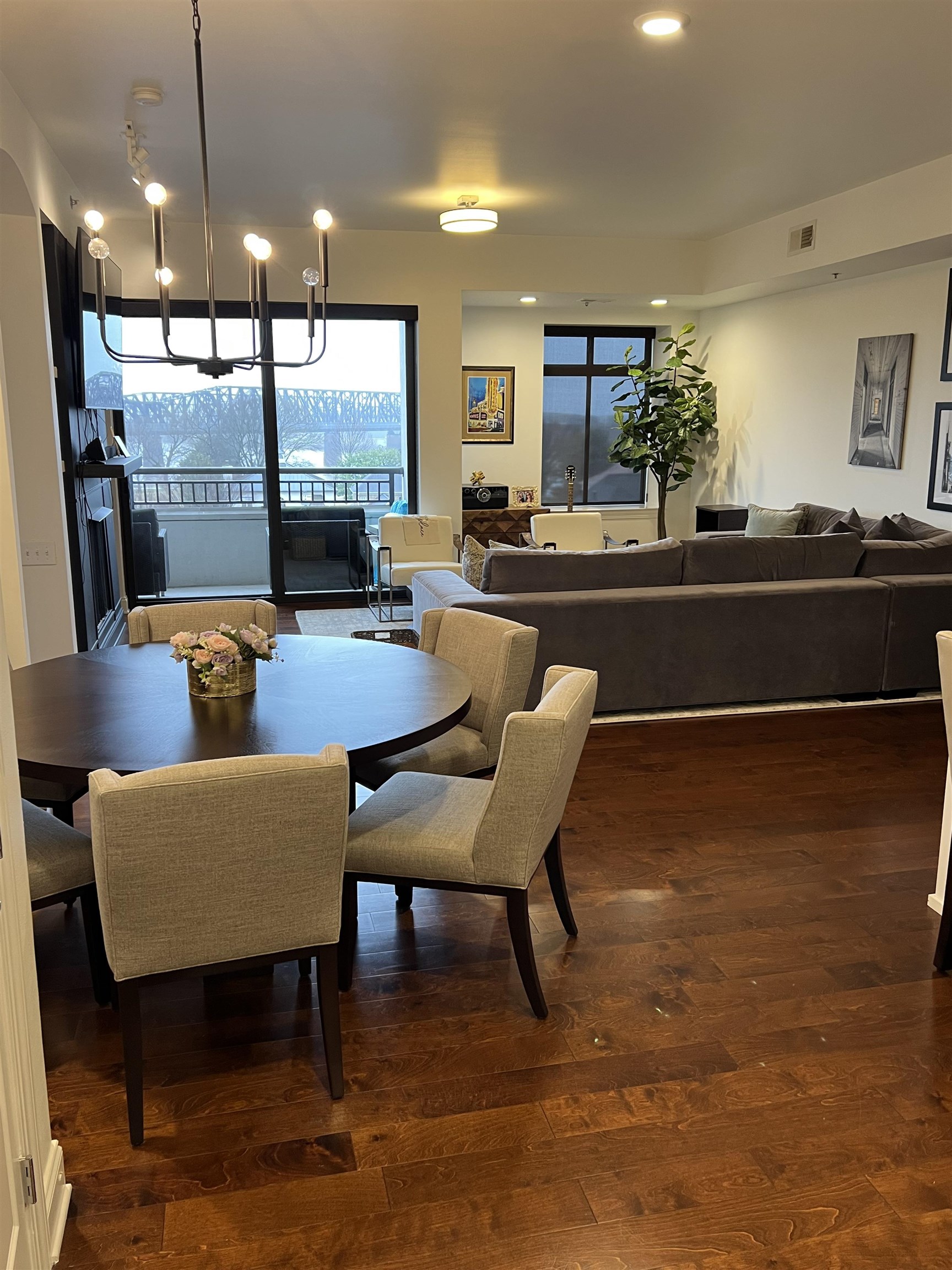 717 Riverside Drive, Unit 505 Memphis, TN 38103 - Photo 9 of 24 a dining room with furniture and a floor to ceiling window