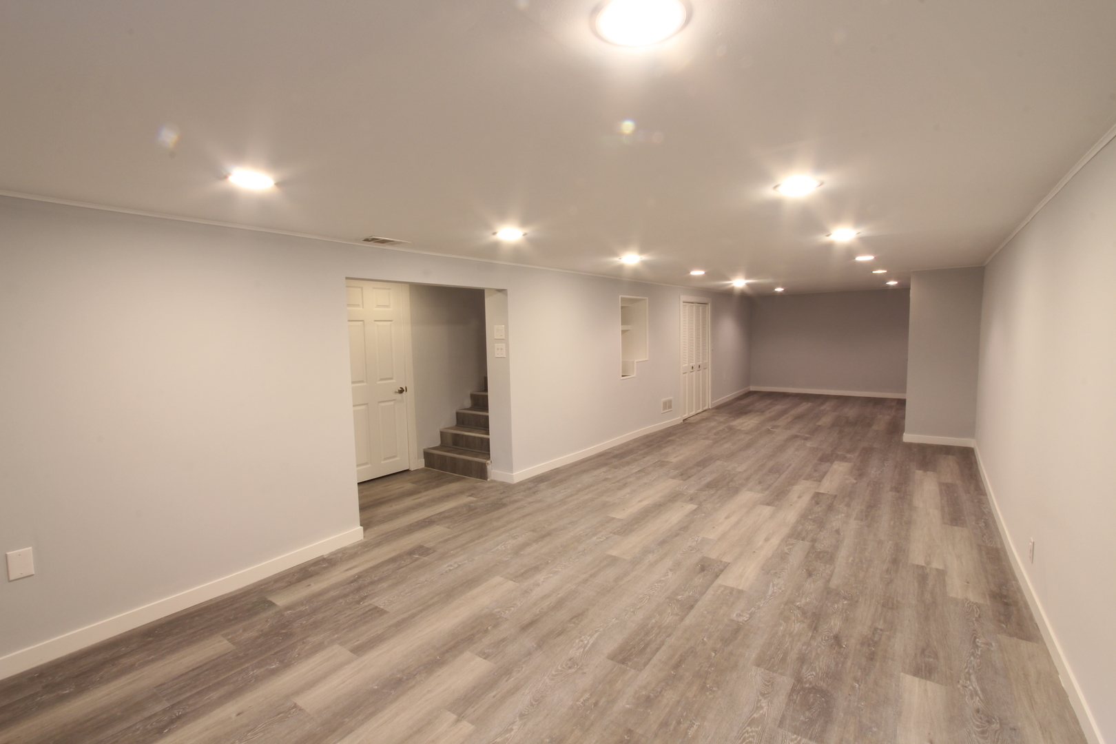 703 Sheridan Road Normal, IL 61761 - Photo 12 of 15 a view of an empty room with wooden floor