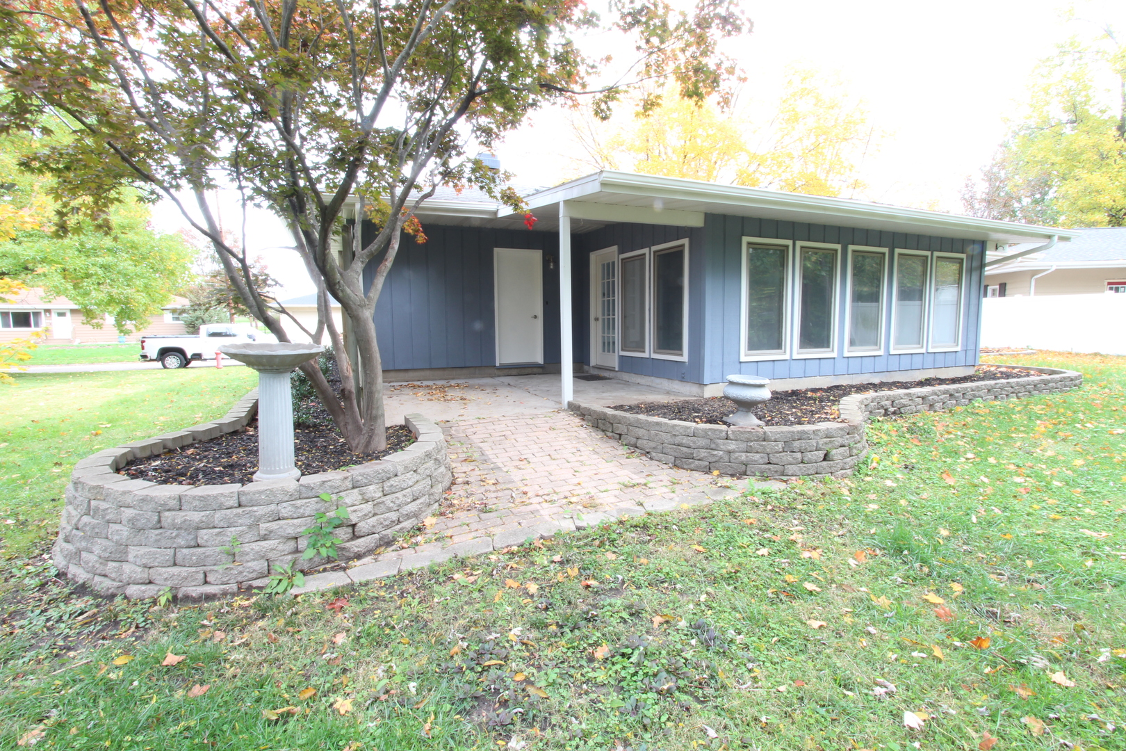 703 Sheridan Road Normal, IL 61761 - Photo 15 of 15 a front view of a house with garden
