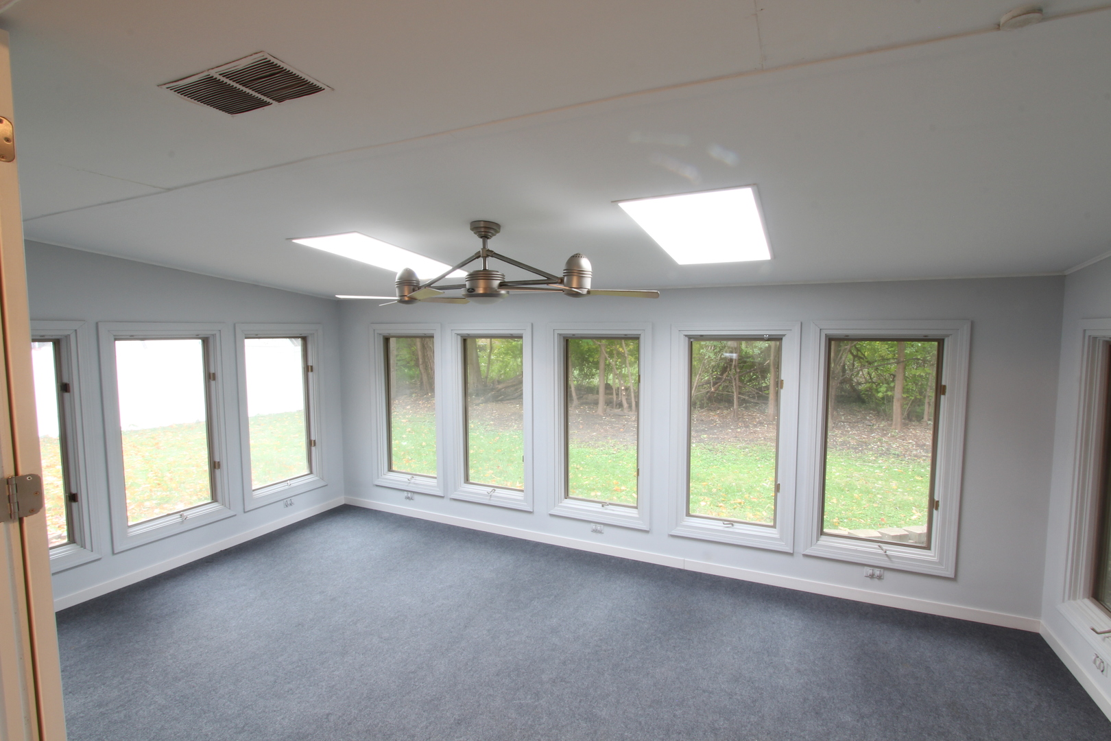 703 Sheridan Road Normal, IL 61761 - Photo 7 of 15 a view of an empty room with a window