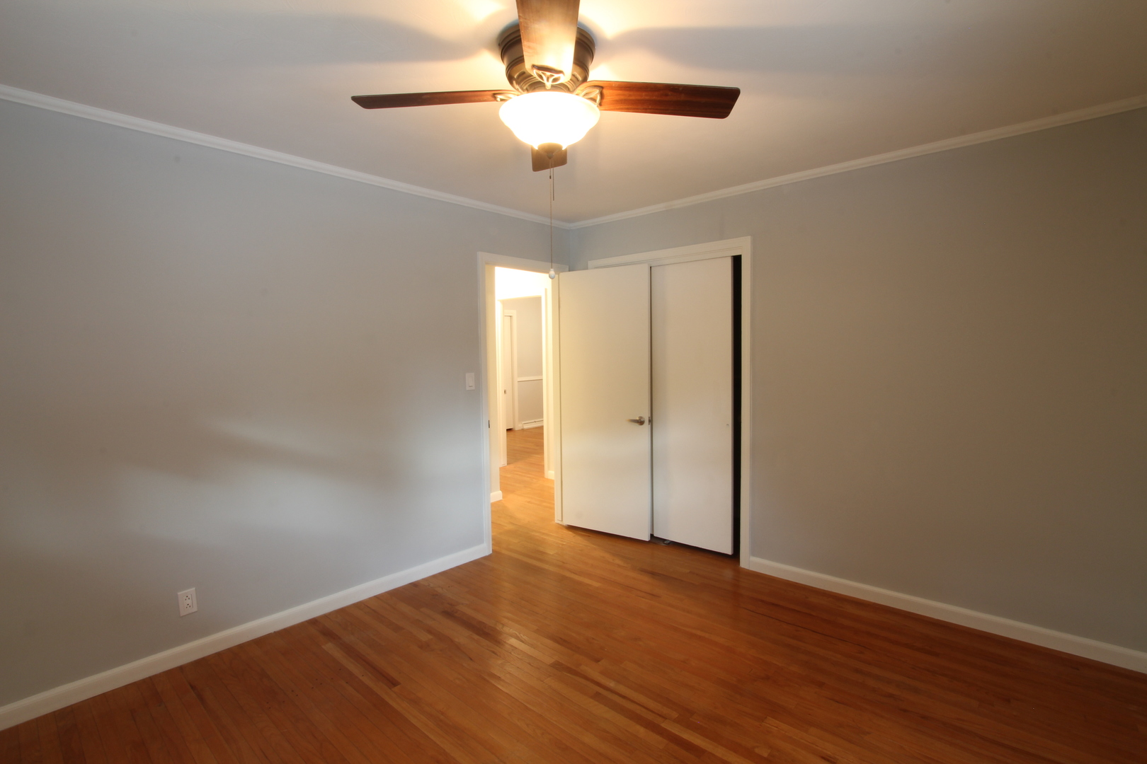 703 Sheridan Road Normal, IL 61761 - Photo 10 of 15 a view of an empty room with wooden floor
