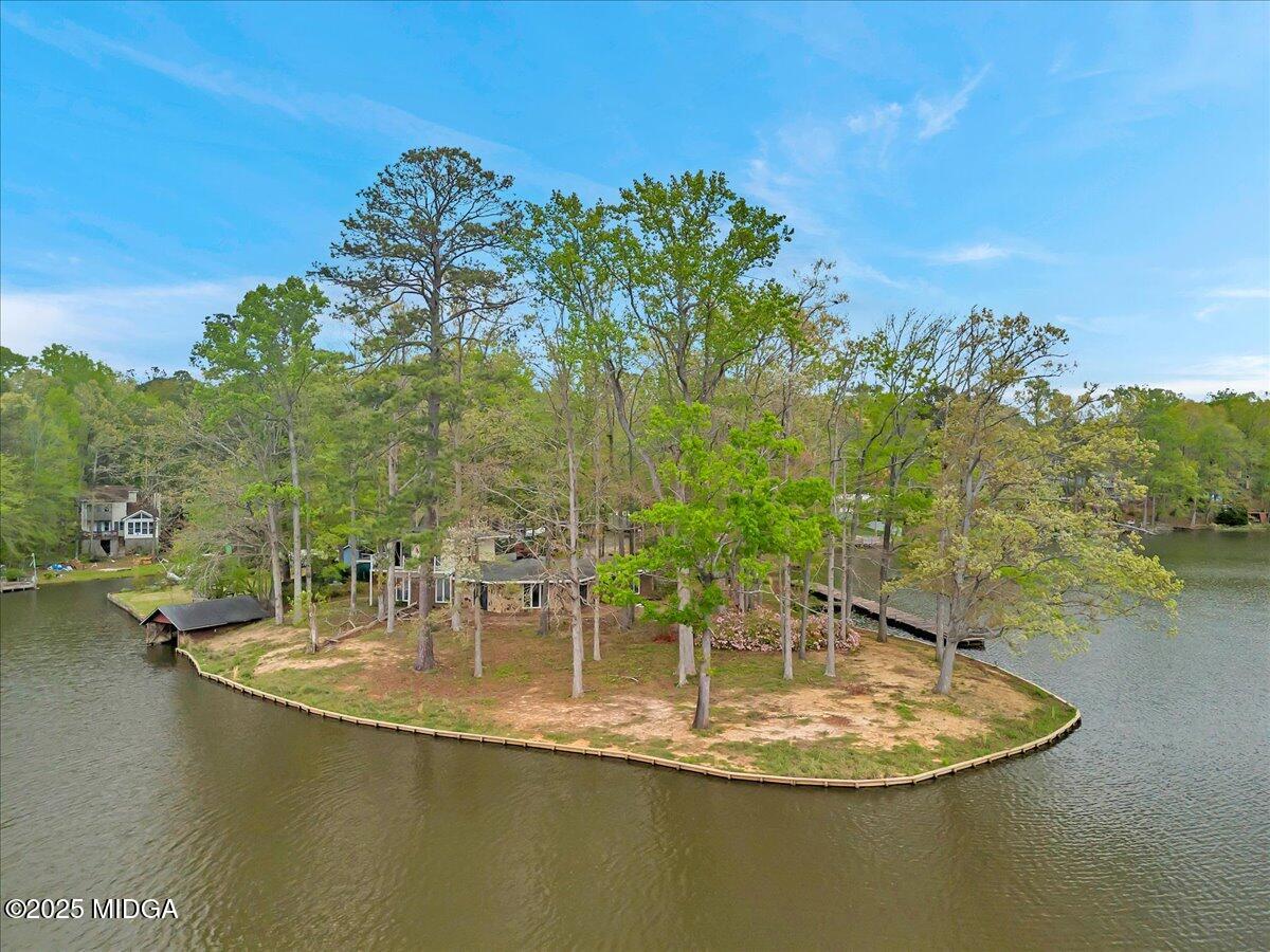 a view of a swimming pool with a yard