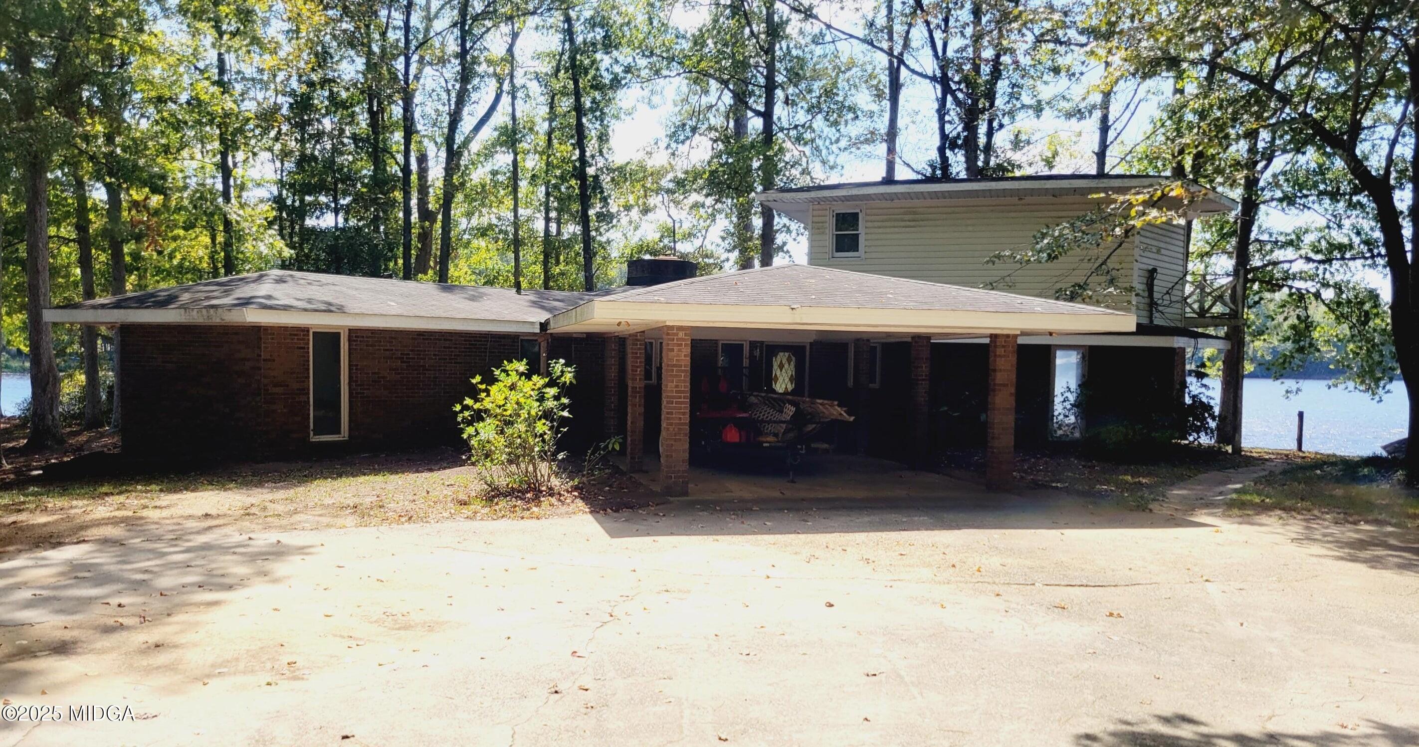 900 South Plantation Parkway Macon, GA 31220 - Photo 19 of 61 a front view of a house with a yard covered with snow