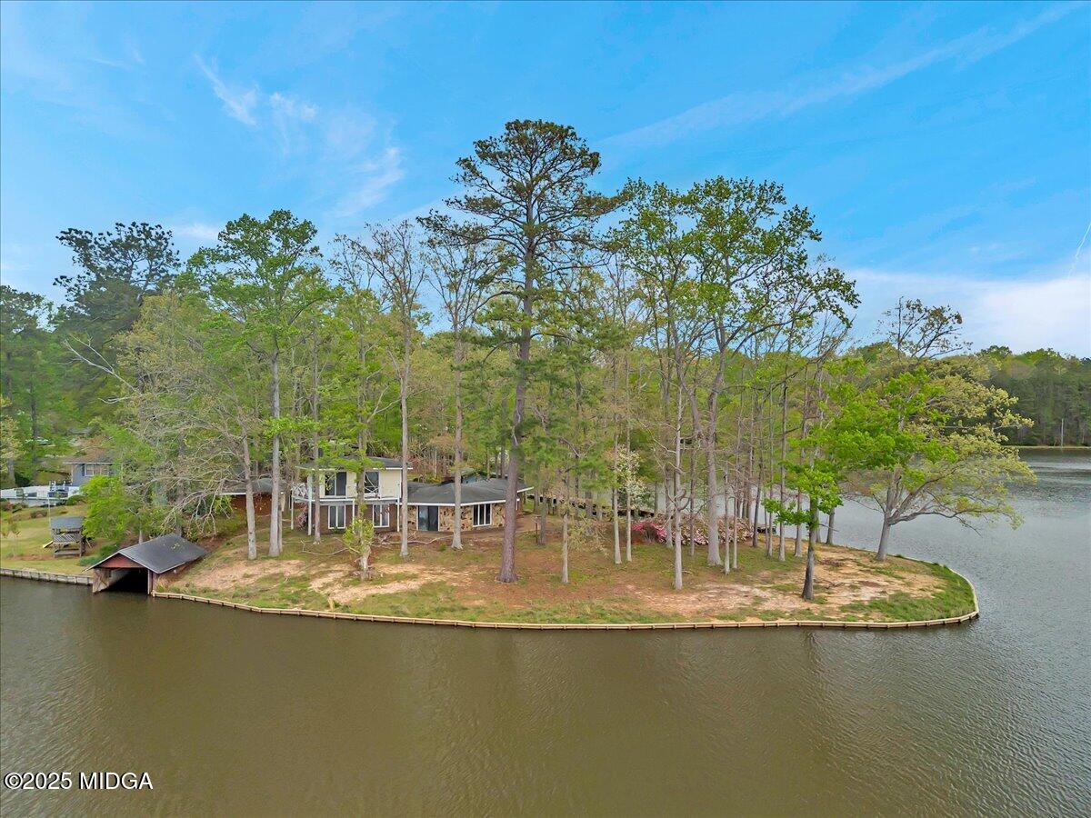 900 South Plantation Parkway Macon, GA 31220 - Photo 2 of 61 a view of a lake with chairs