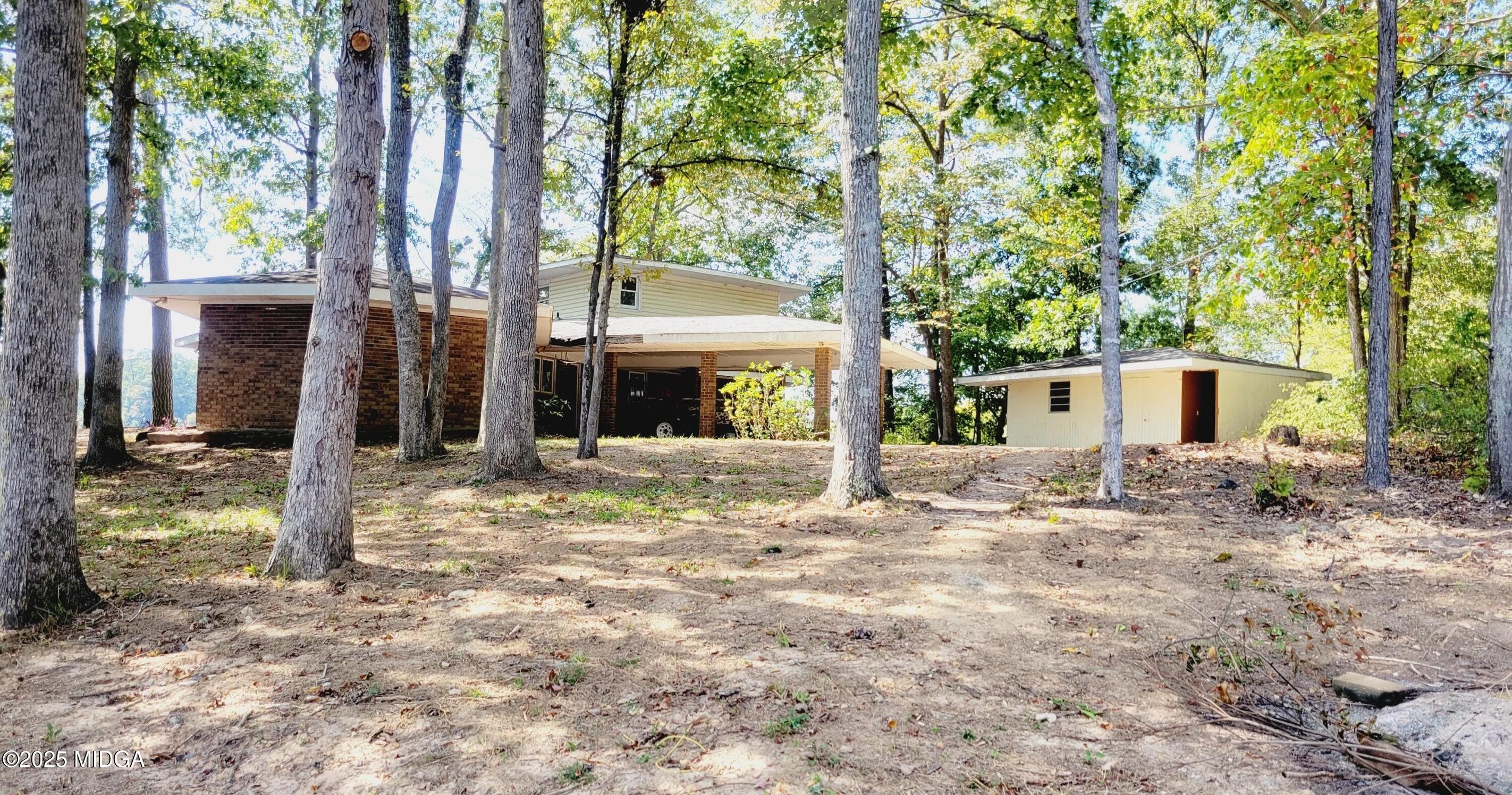 900 South Plantation Parkway Macon, GA 31220 - Photo 22 of 61 a view of a house with a yard and large tree