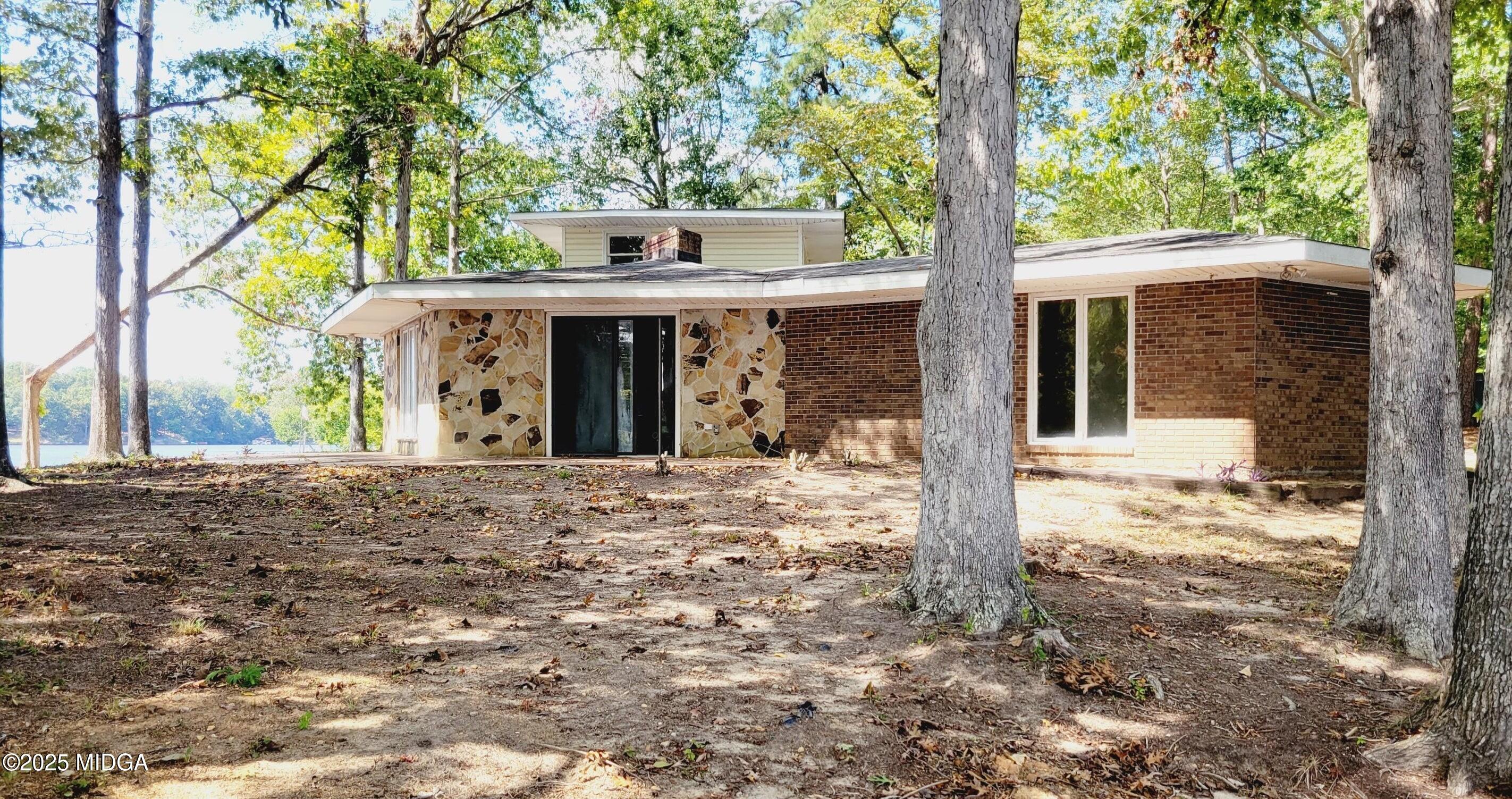 900 South Plantation Parkway Macon, GA 31220 - Photo 23 of 61 a view of a house with a yard and large tree