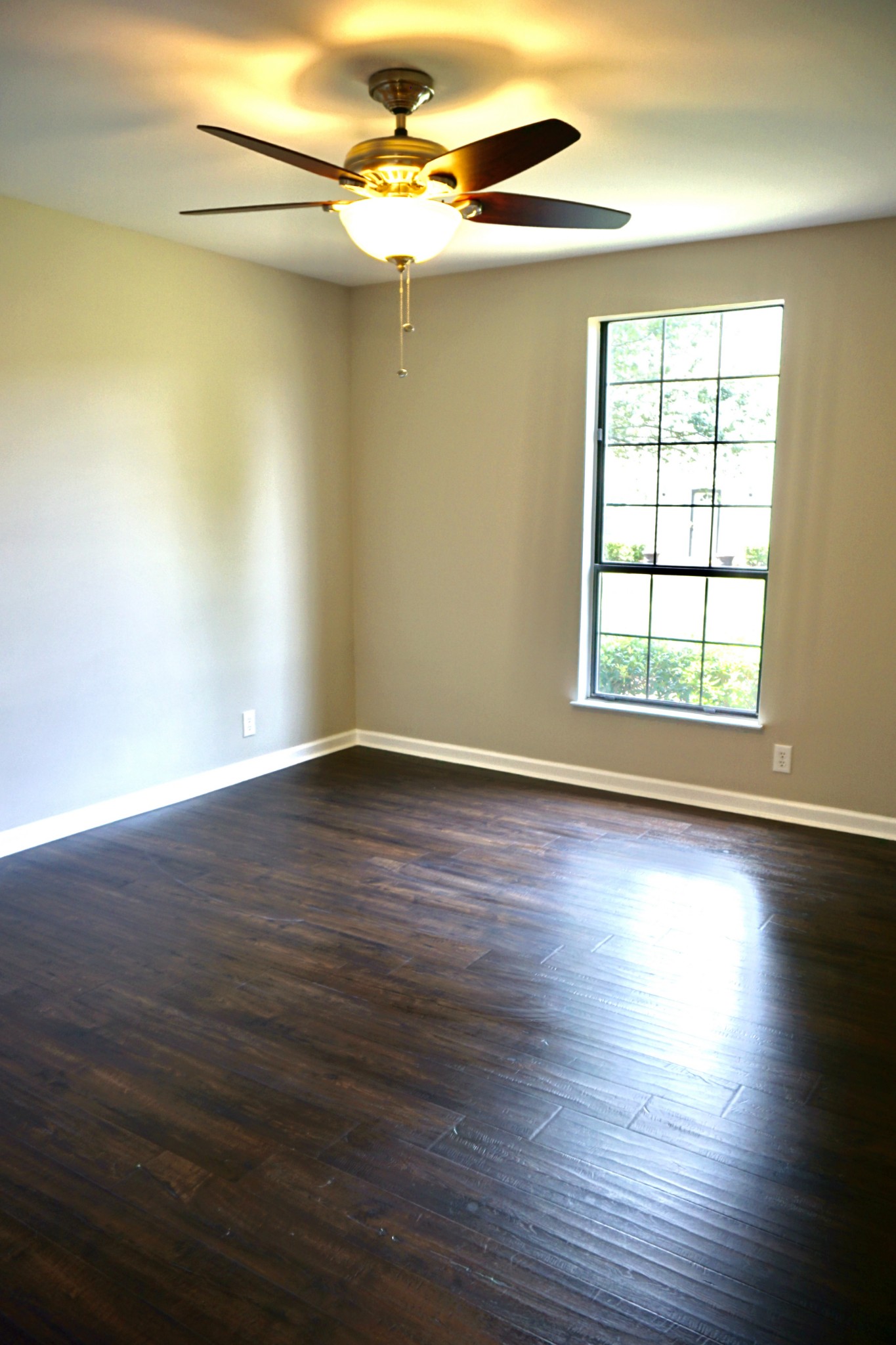 1215 General George Patton Road Nashville, TN 37221 - Photo 8 of 18 a view of an empty room with wooden floor and a window