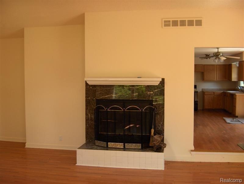1700 North Hughes Road Howell, MI 48843 - Photo 5 of 6 Family Room Fireplace