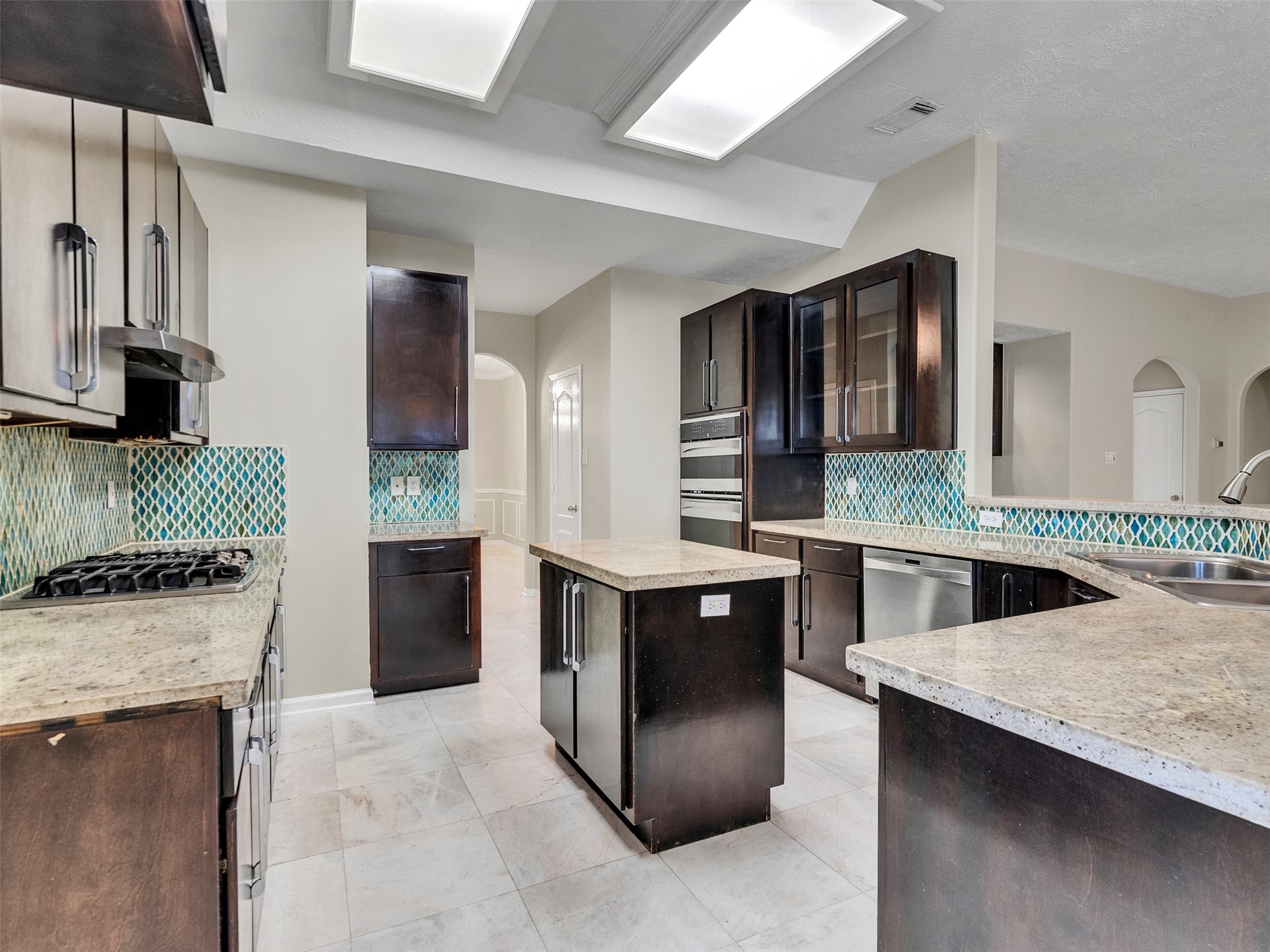 4414 Santee Drive Baytown, TX 77521 - Photo 14 of 50 a kitchen with stainless steel appliances granite countertop a sink stove and refrigerator