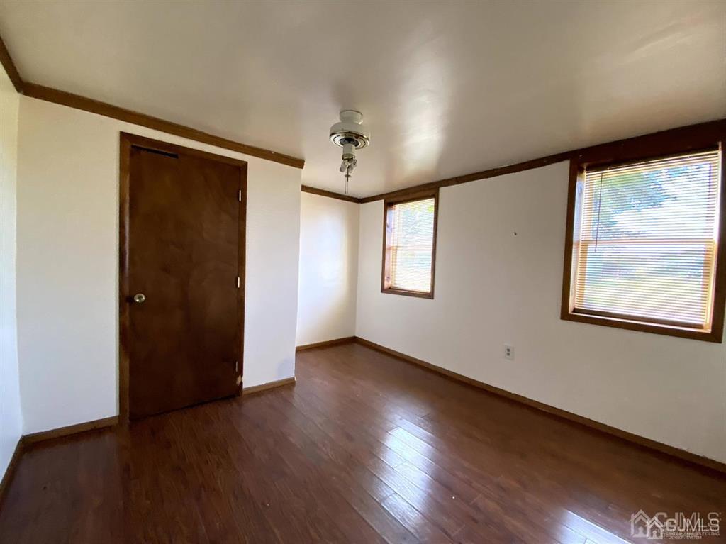 200 North Pemberton Road Pemberton, NJ 08068 - Photo 17 of 27 a view of an empty room with a window and wooden floor