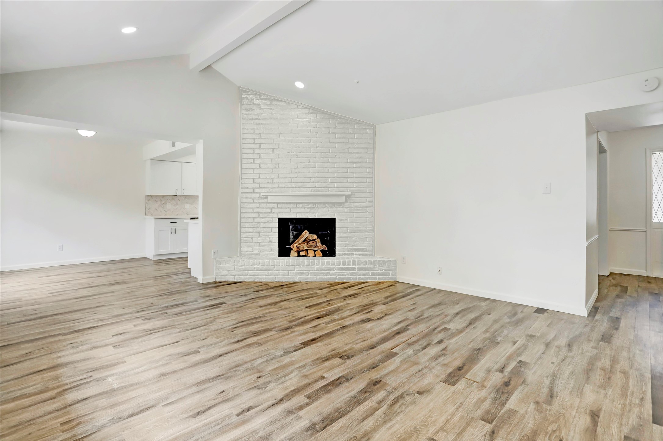 14035 Myrtlea Drive Houston, TX 77079 - Photo 15 of 38 This photo shows what the living area would look like with a white fireplace. The landlord is open to a discussion about allowing it to be painted should tenant desire.