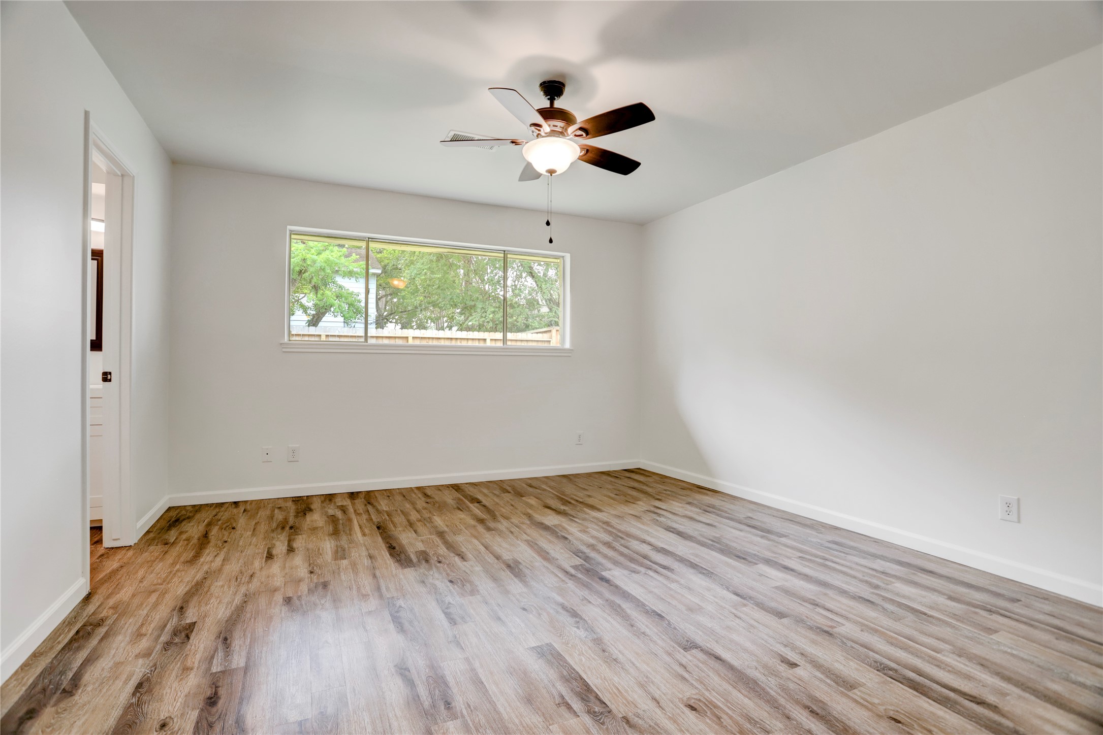 14035 Myrtlea Drive Houston, TX 77079 - Photo 20 of 38 The large primary bedroom has a walk-in closet and ensuite bathroom.