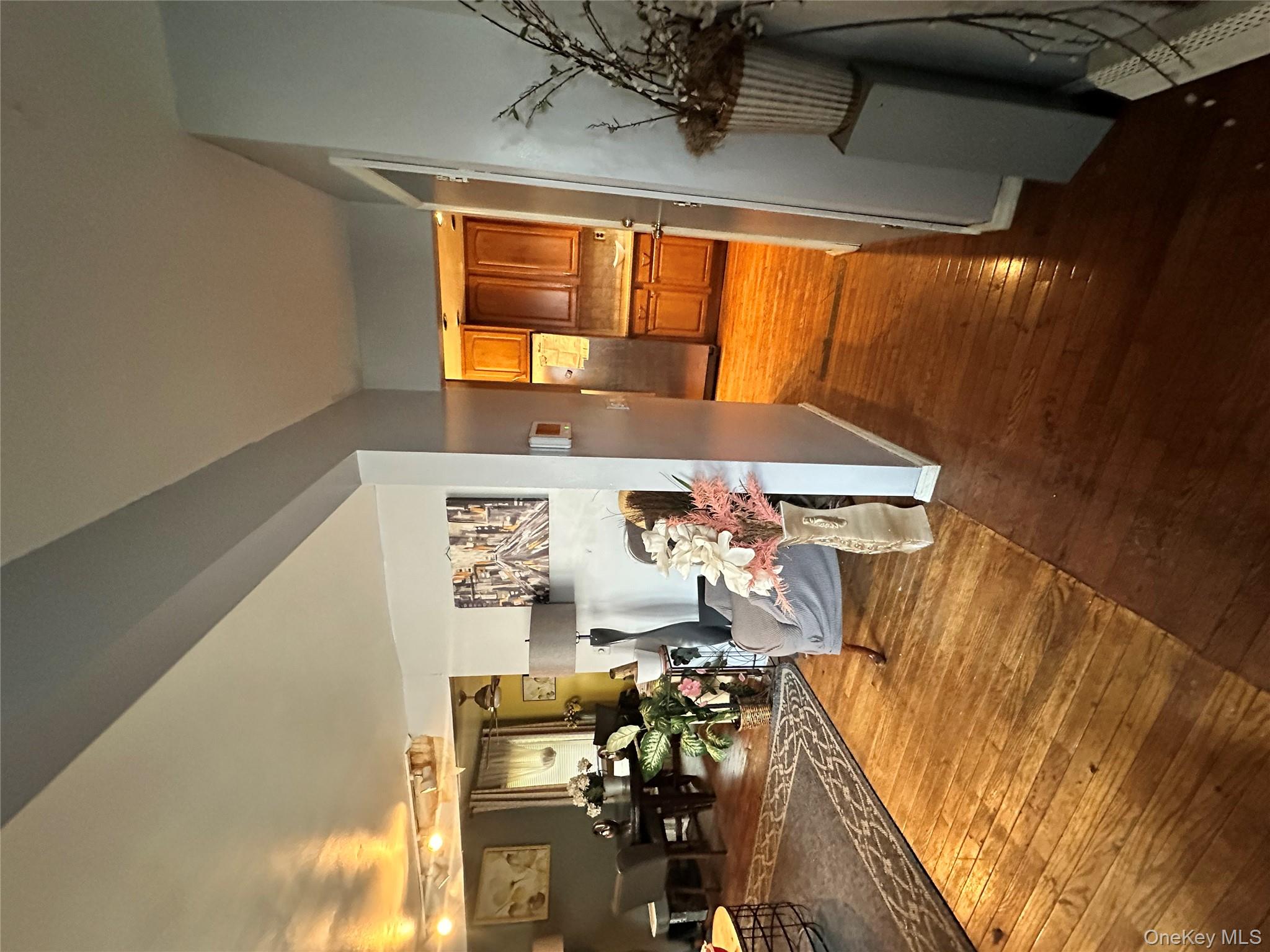 16 Spring Street Roosevelt, NY 11575 - Photo 18 of 19 a living room with furniture and a flat screen tv