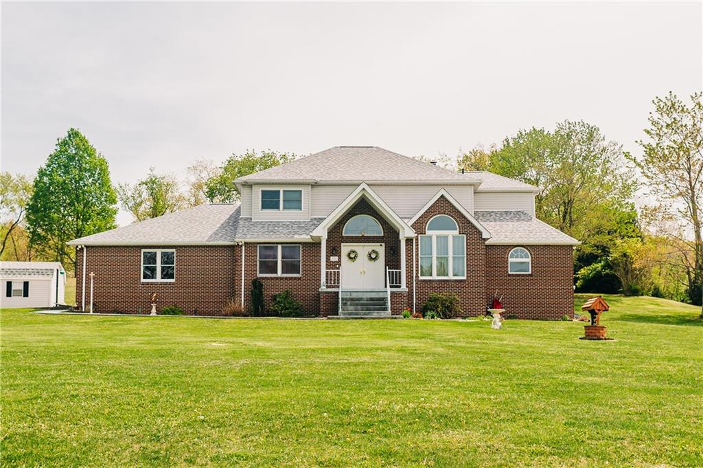 329 Breakiron Road Connellsville, PA 15425 - Photo 1 of 19 a front view of house with yard and green space