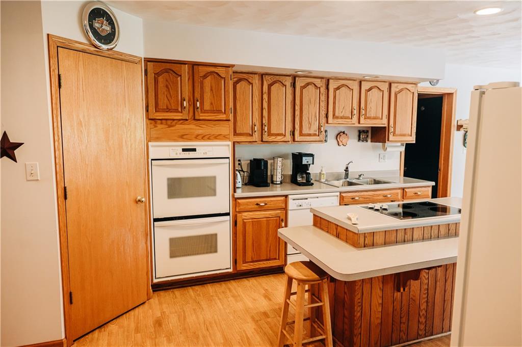 329 Breakiron Road Connellsville, PA 15425 - Photo 11 of 19 a kitchen with stainless steel appliances granite countertop a refrigerator a stove and a sink with cabinets