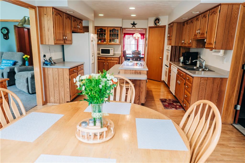 329 Breakiron Road Connellsville, PA 15425 - Photo 12 of 19 a view of a dining room with furniture a kitchen and chandelier