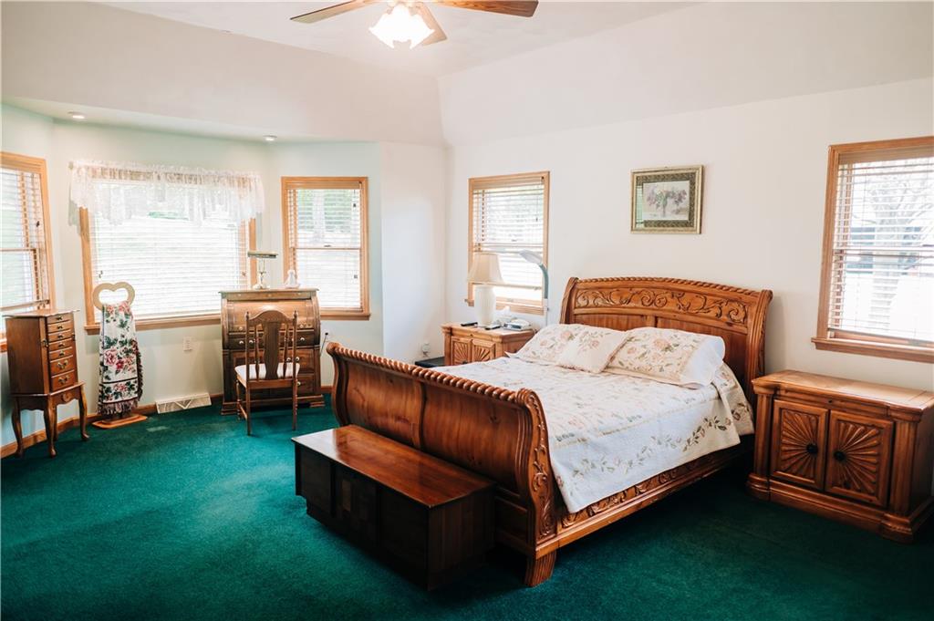 329 Breakiron Road Connellsville, PA 15425 - Photo 15 of 19 a bedroom with a bed chair and a window