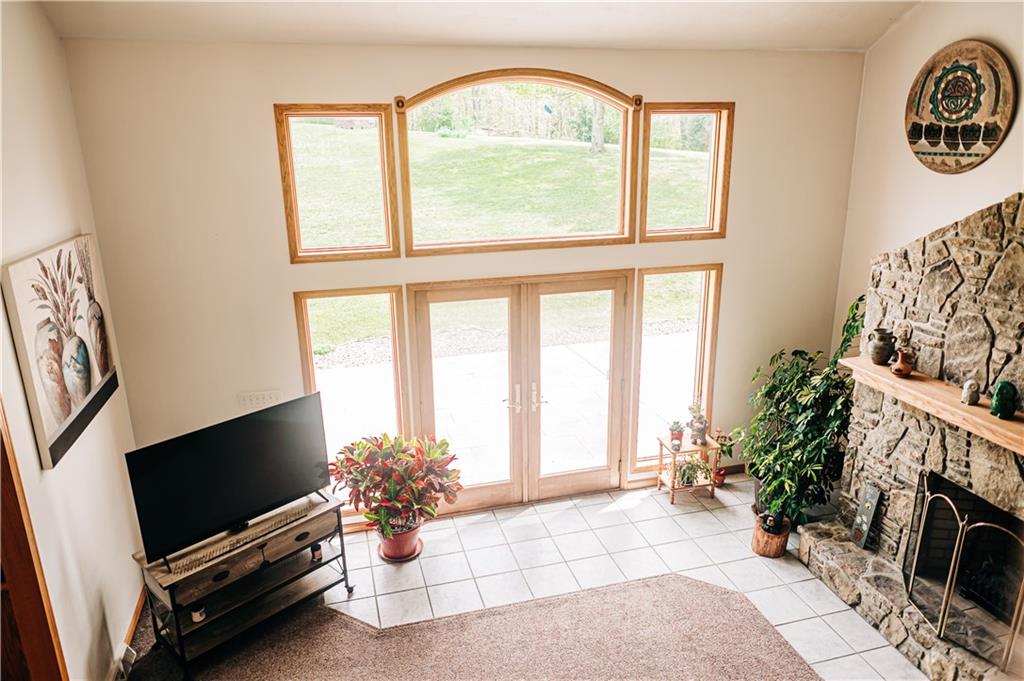 329 Breakiron Road Connellsville, PA 15425 - Photo 7 of 19 a living room with fireplace furniture and a flat screen tv