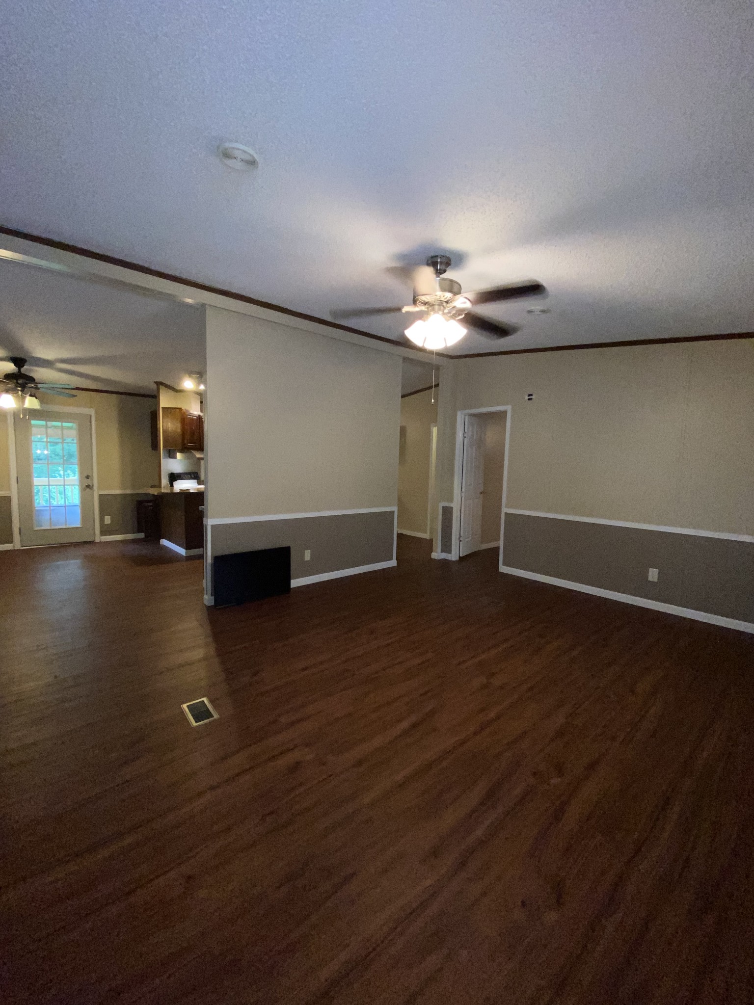 7106 Lake Road Northwest Fairview, TN 37062 - Photo 12 of 20 The Living Room is located on the front side of the home. A small wall divides it from the Kitchen. The home is very open and spacious. New Paint Thru Out