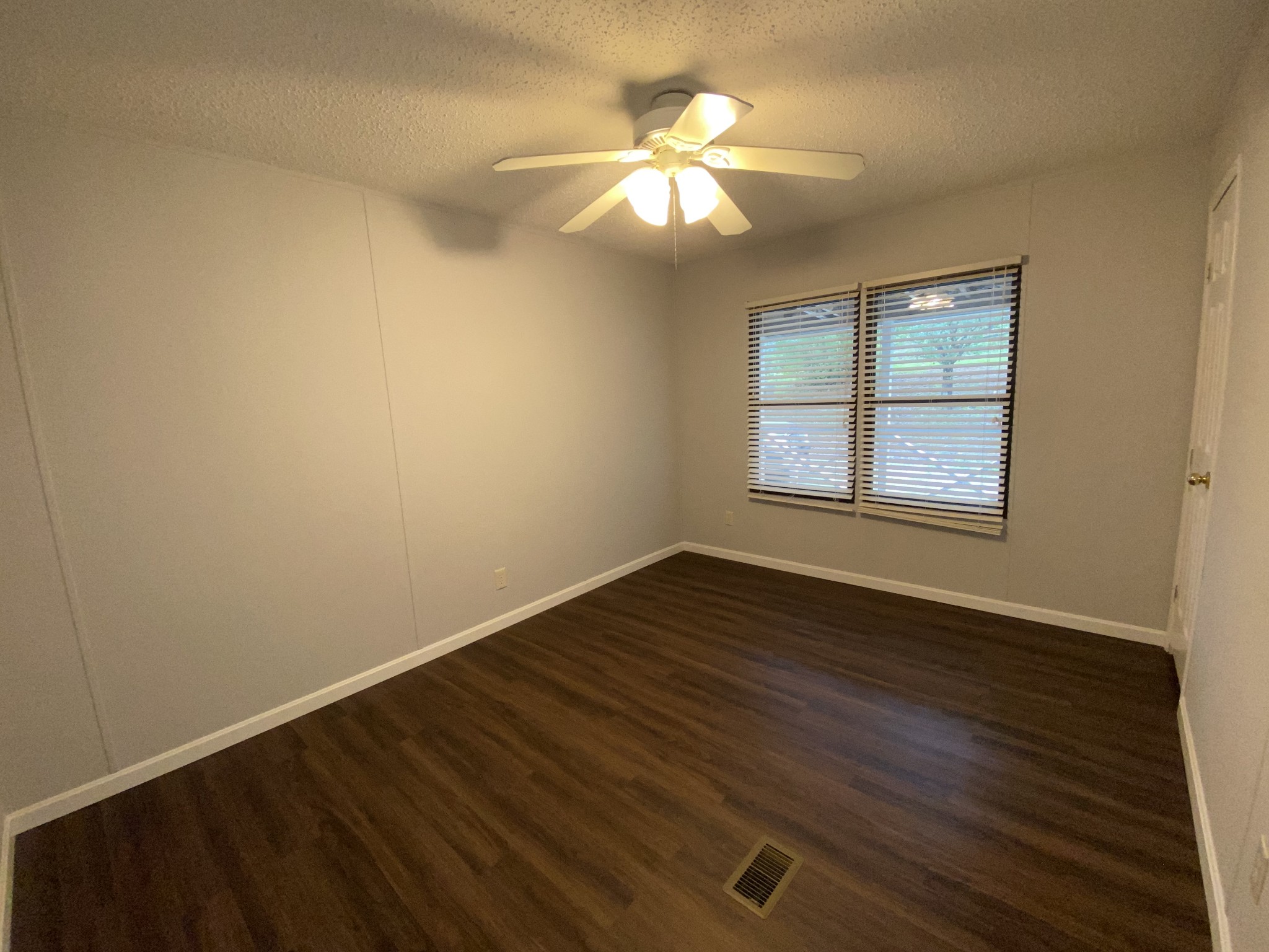 7106 Lake Road Northwest Fairview, TN 37062 - Photo 20 of 20 Bedroom 4 measures 10x13 - has large walk-in closet, ceiling fan and laminate flooring