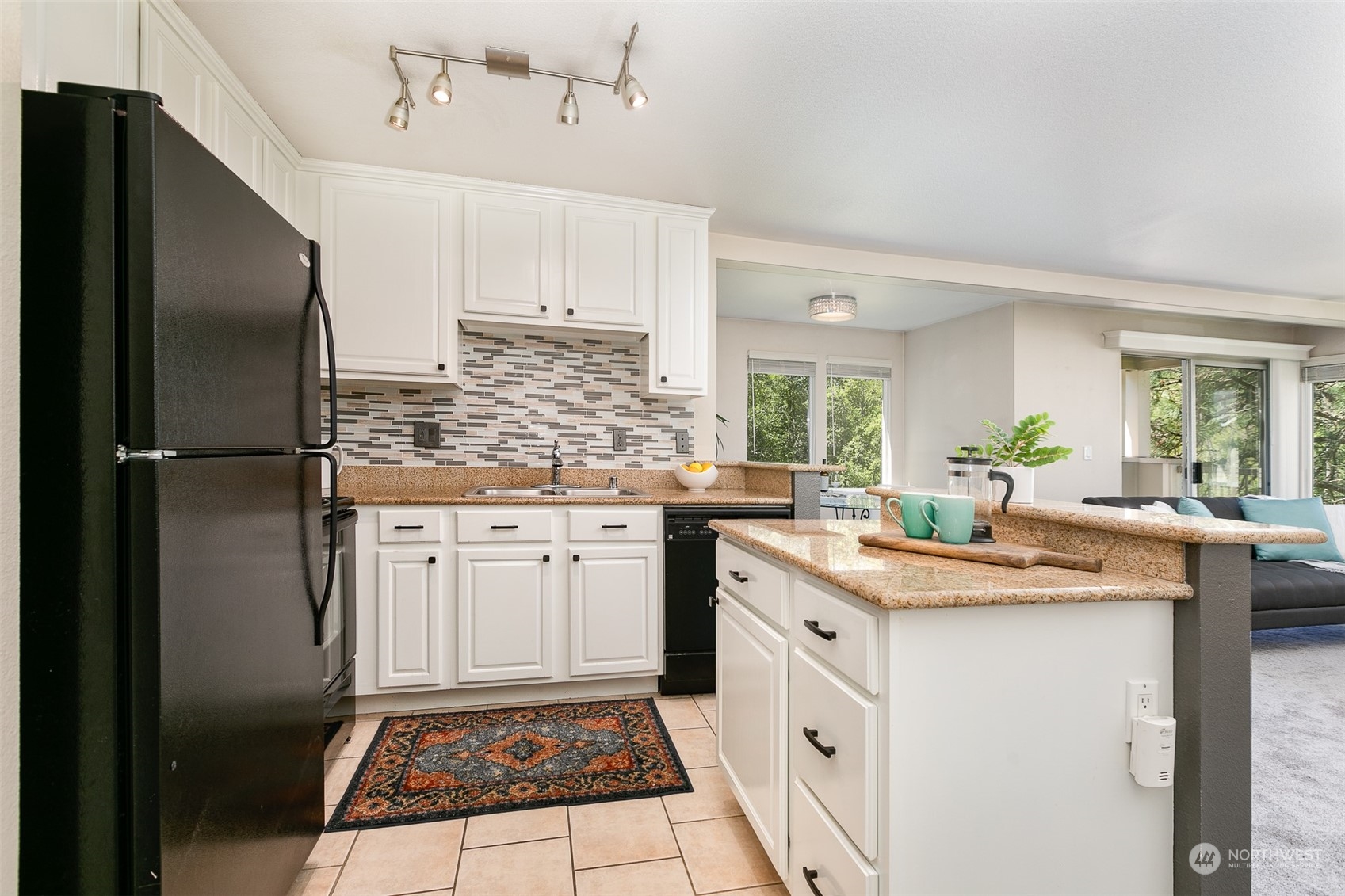 20326 Bothell Everett Highway, Unit G201 Bothell, WA 98012 - Photo 8 of 15 a kitchen with a sink stove and refrigerator