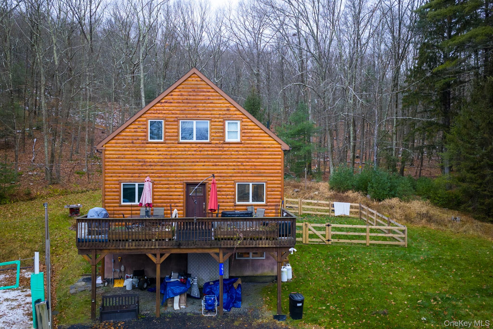 191 David Rhodes Road Wurtsboro, NY 12790 - Photo 5 of 39 a view of house with outdoor seating and covered with trees