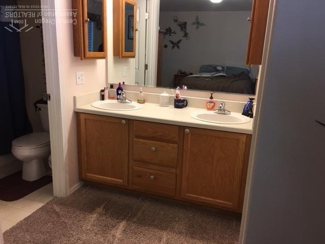 62637 Hawkview Road Bend, OR 97701 - Photo 15 of 19 a bathroom with a sink and a mirror