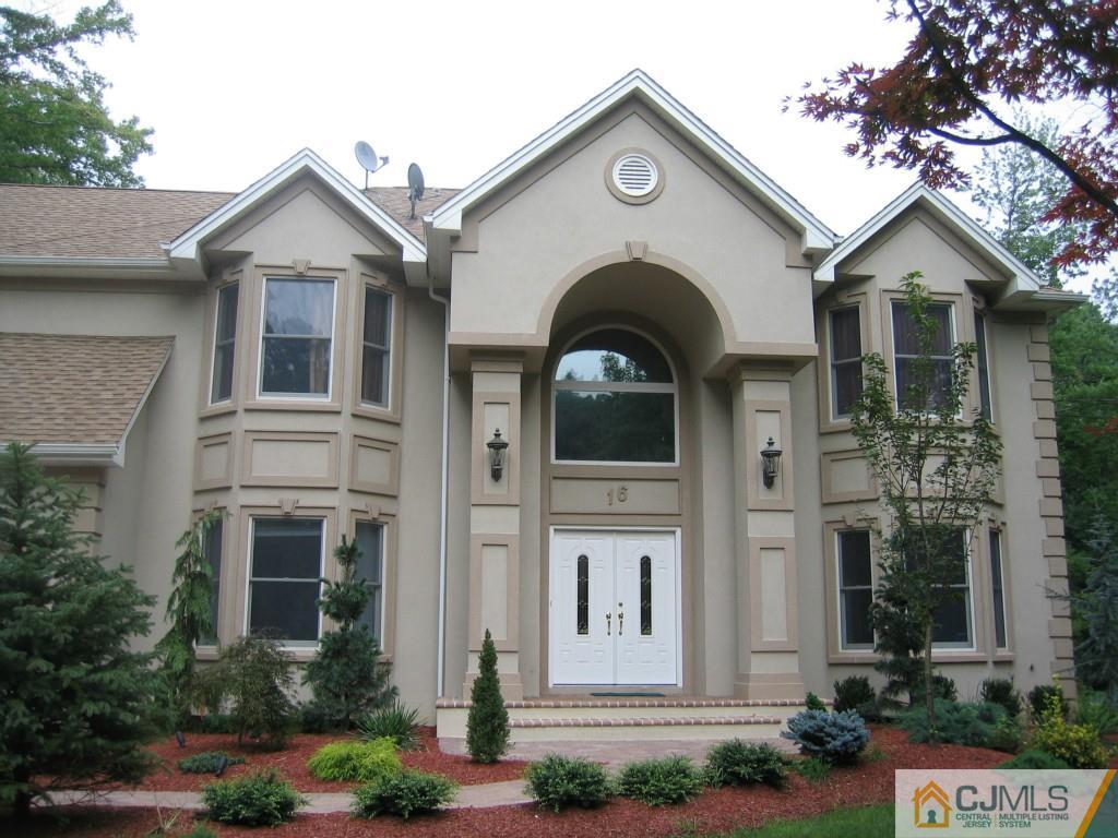 16 Parker Road Edison, NJ 08820 - Photo 1 of 25 a front view of a house with garden