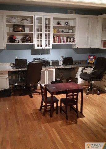 16 Parker Road Edison, NJ 08820 - Photo 12 of 25 a kitchen with a stove and a refrigerator