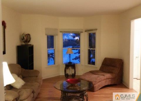 16 Parker Road Edison, NJ 08820 - Photo 13 of 25 a living room with furniture and wooden floor