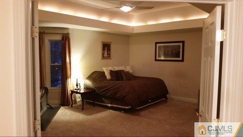 16 Parker Road Edison, NJ 08820 - Photo 14 of 25 a bedroom with a bed and a window