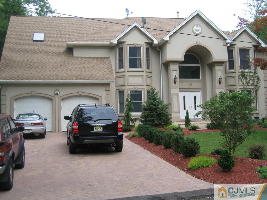 16 Parker Road Edison, NJ 08820 - Photo 3 of 25 a car parked in front of a house