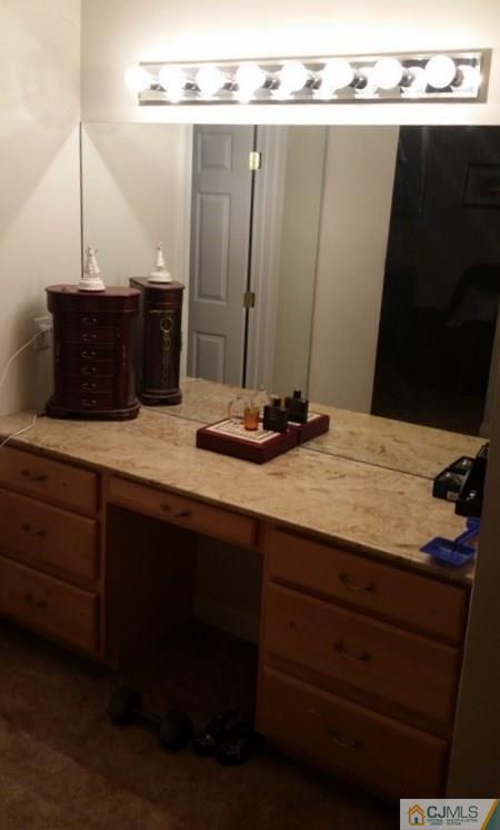 16 Parker Road Edison, NJ 08820 - Photo 25 of 25 a bathroom with a granite countertop sink and a mirror