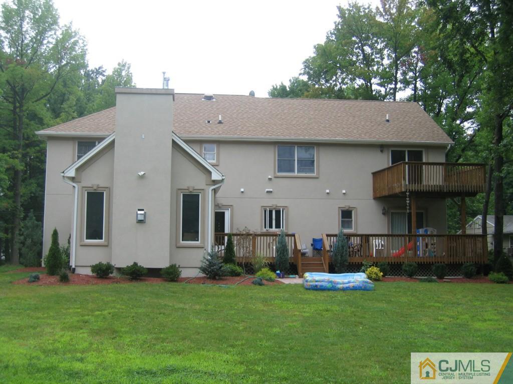 16 Parker Road Edison, NJ 08820 - Photo 4 of 25 a view of a house with backyard and garden